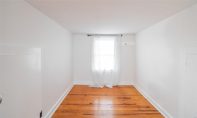 empty room with wood-type flooring