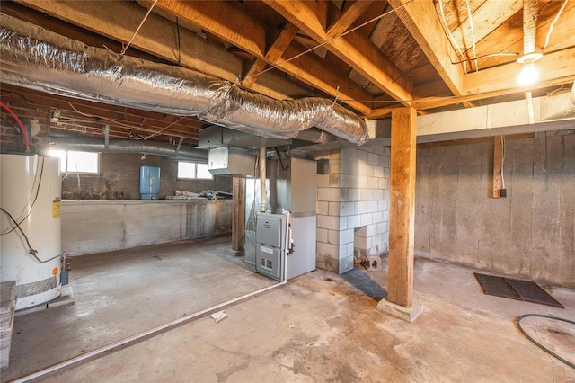 basement featuring heating unit and gas water heater