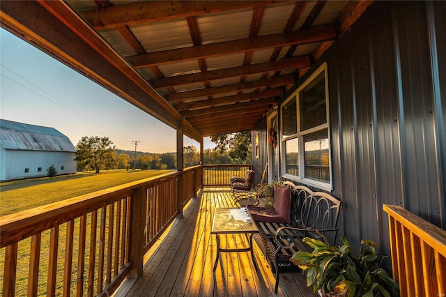 wooden deck with a lawn