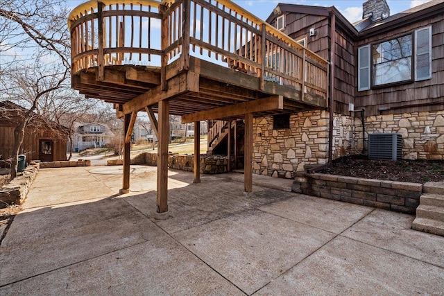 view of patio / terrace with cooling unit and stairs