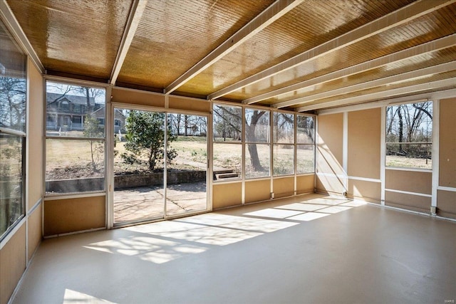 unfurnished sunroom featuring a healthy amount of sunlight