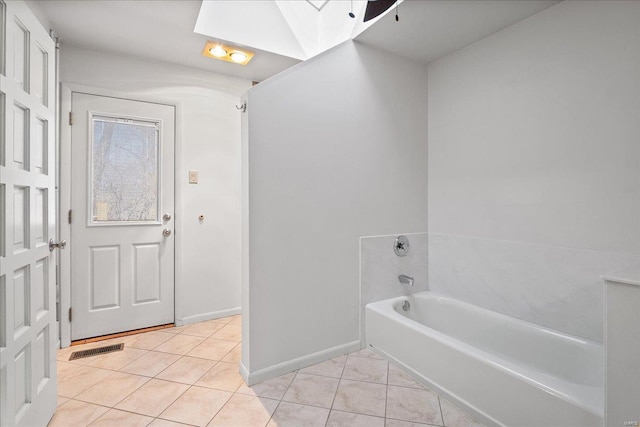 full bath featuring visible vents, baseboards, a bath, and tile patterned flooring