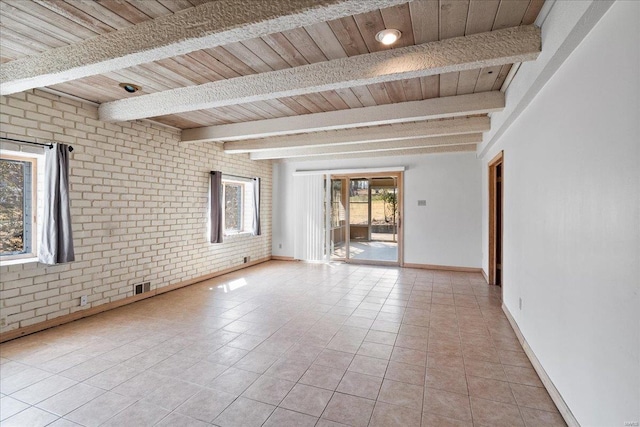 empty room featuring visible vents, brick wall, beamed ceiling, wood ceiling, and light tile patterned flooring