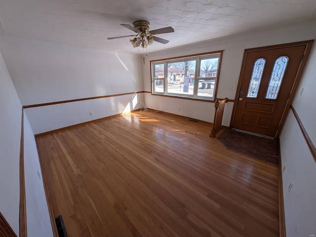 foyer with hardwood / wood-style flooring and ceiling fan