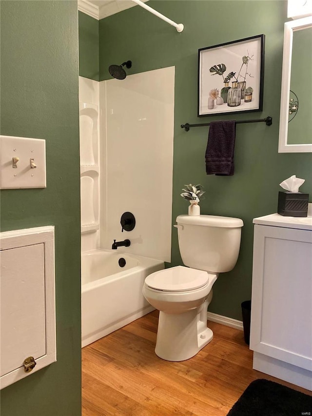 bathroom with shower / bath combination, wood-type flooring, and toilet