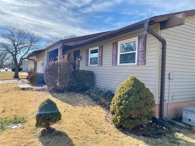 view of property exterior with a garage