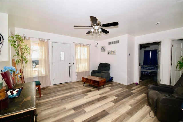 interior space featuring ceiling fan and light wood-type flooring