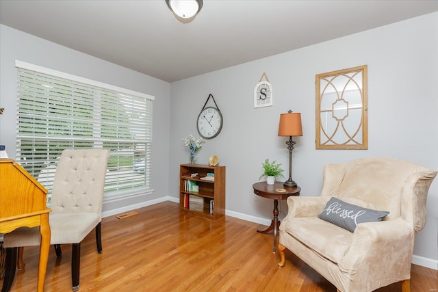 living area with light hardwood / wood-style floors