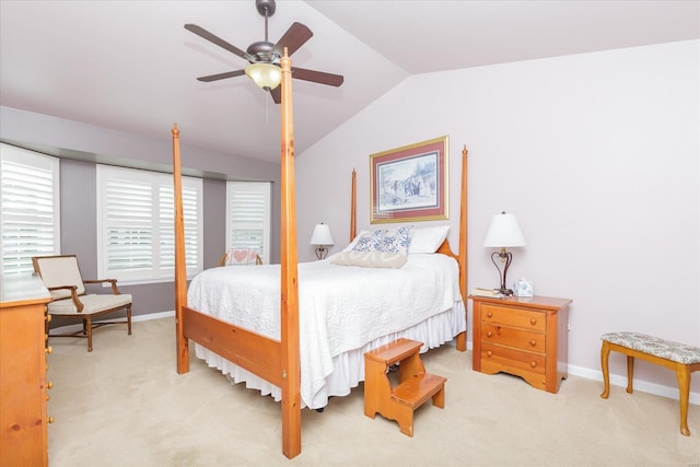 carpeted bedroom featuring ceiling fan and vaulted ceiling