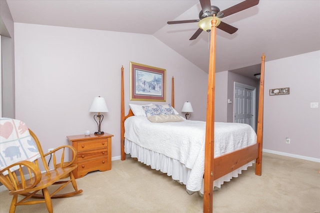 carpeted bedroom with ceiling fan and vaulted ceiling