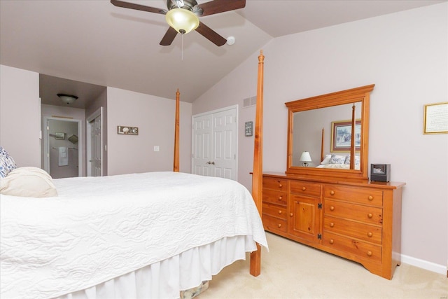 carpeted bedroom featuring lofted ceiling, ceiling fan, and a closet