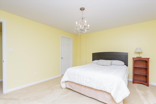 carpeted bedroom with a chandelier