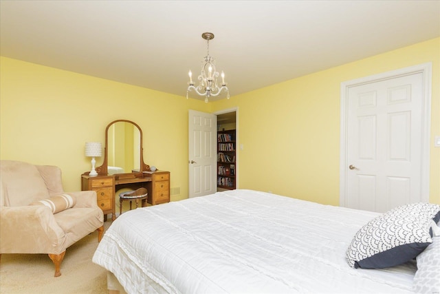 carpeted bedroom with an inviting chandelier