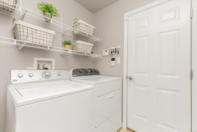 laundry room with separate washer and dryer