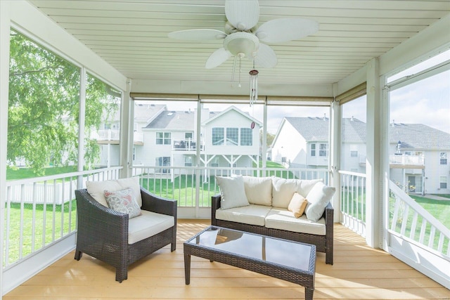 sunroom featuring ceiling fan