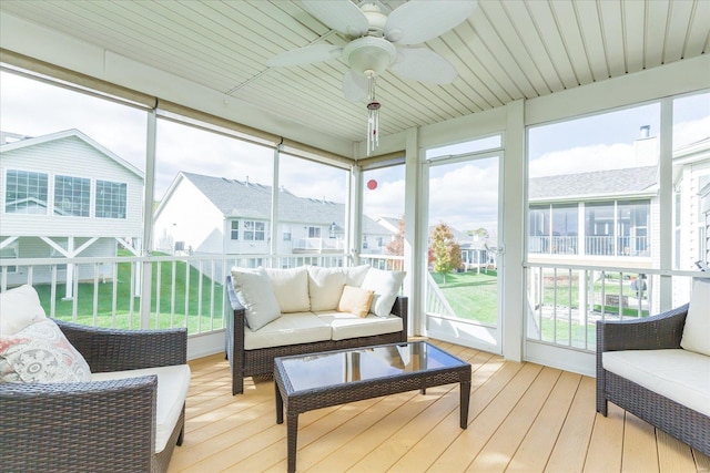 sunroom featuring a wealth of natural light and ceiling fan