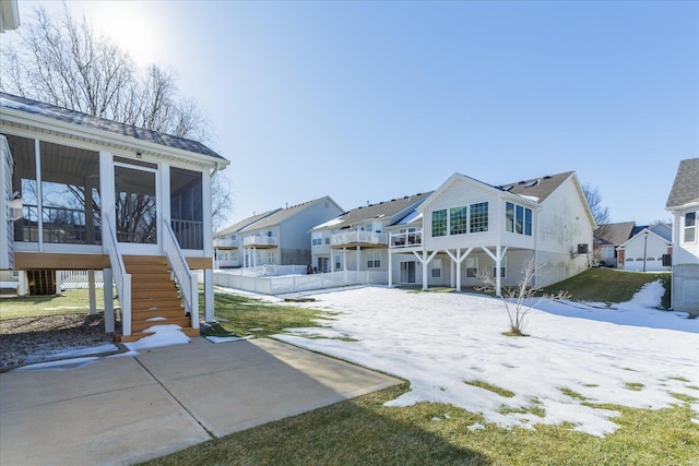 rear view of house with a sunroom