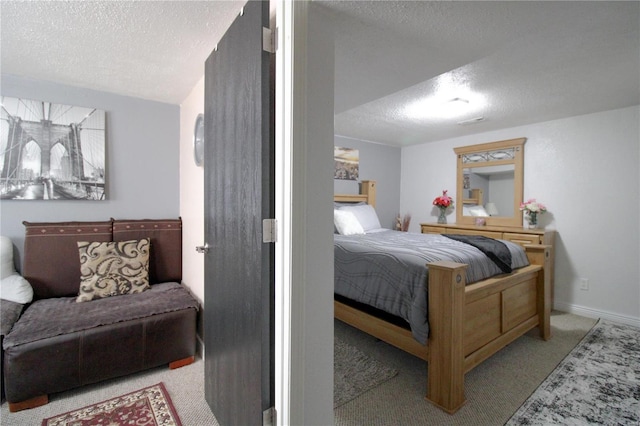 carpeted bedroom with a textured ceiling