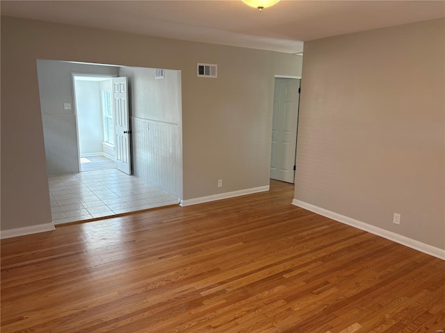 unfurnished room with light hardwood / wood-style floors