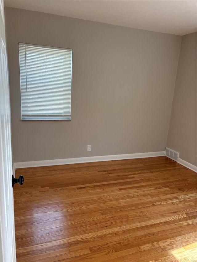 unfurnished room with light hardwood / wood-style floors