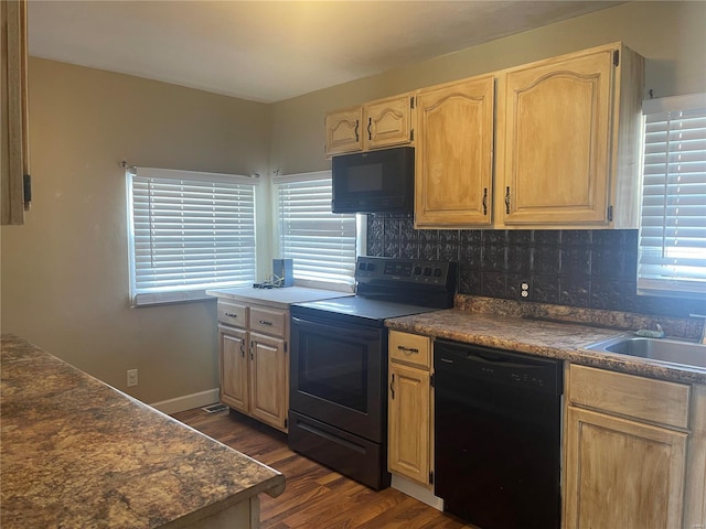 kitchen featuring sink, dark wood-type flooring, decorative backsplash, and black appliances