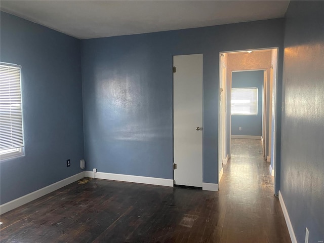 empty room featuring dark hardwood / wood-style floors