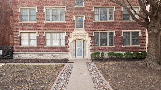 view of front of property featuring brick siding