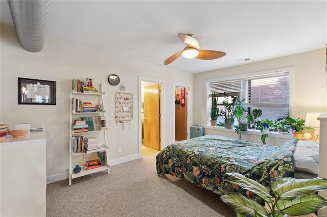 bedroom featuring visible vents, carpet flooring, baseboards, and ceiling fan