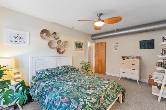 carpeted bedroom featuring a ceiling fan and baseboards