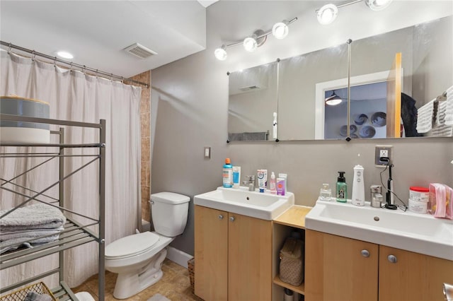 bathroom with visible vents, toilet, two vanities, a sink, and a shower with shower curtain