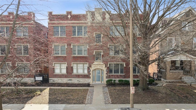 view of front of property featuring brick siding