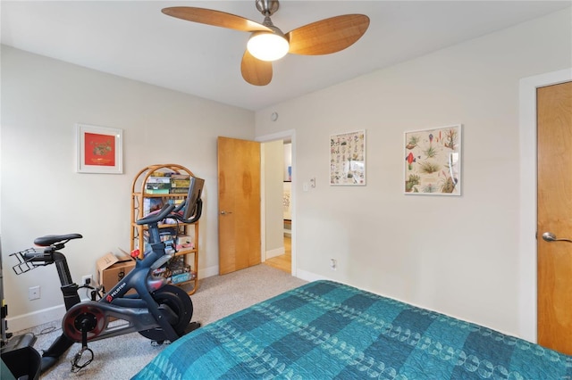 carpeted bedroom featuring a ceiling fan and baseboards