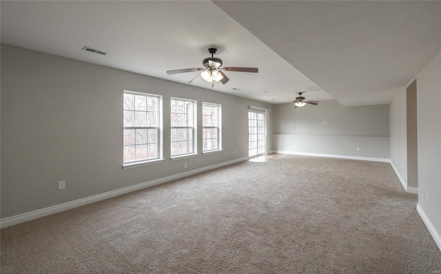 empty room with carpet floors and ceiling fan