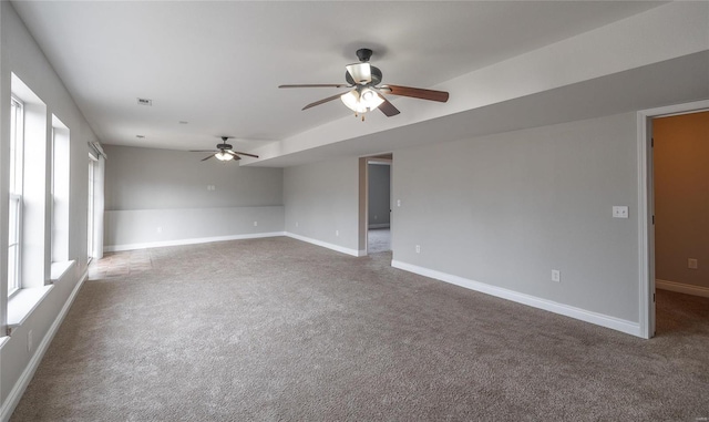 carpeted spare room with ceiling fan