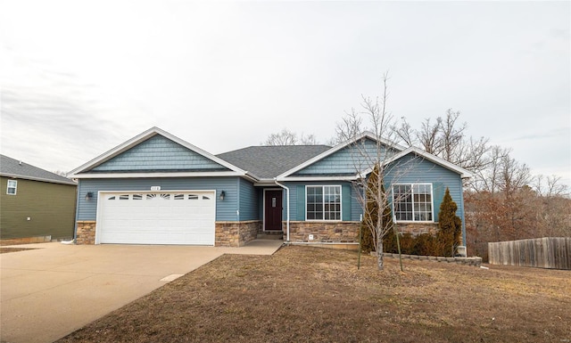 craftsman-style house with a garage and a front lawn