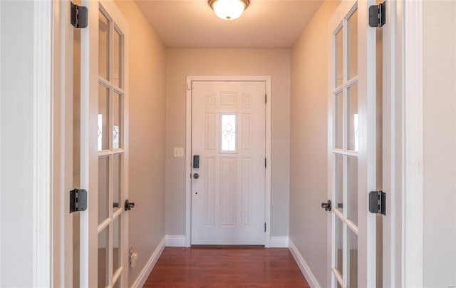 doorway to outside featuring dark hardwood / wood-style floors and french doors