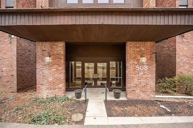 view of exterior entry featuring french doors