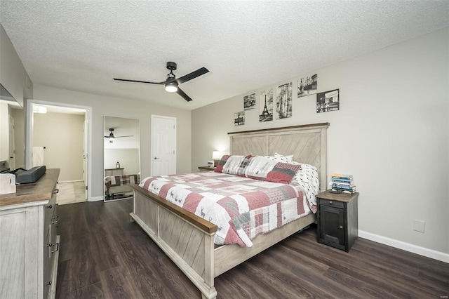 bedroom featuring ceiling fan, dark hardwood / wood-style floors, and a textured ceiling