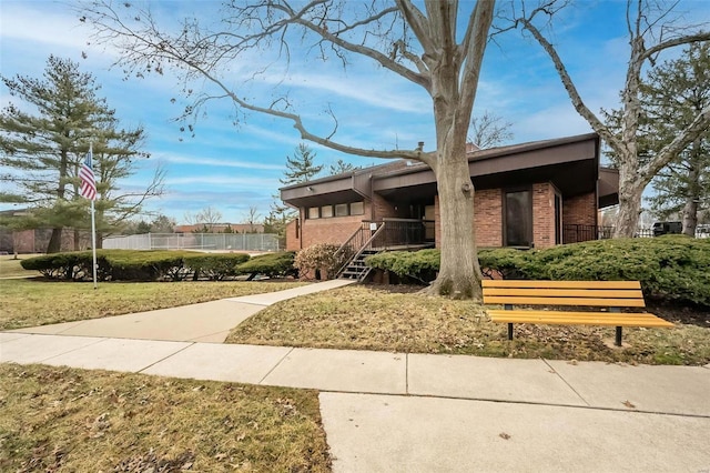 view of property's community with a yard