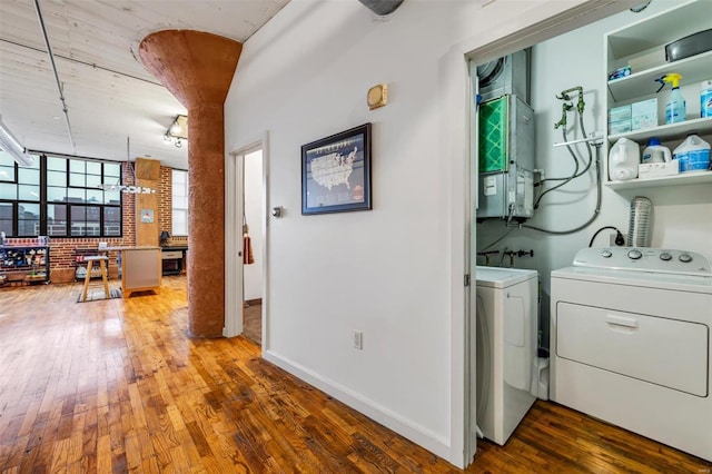 laundry area with hardwood / wood-style flooring