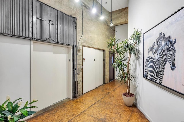 hallway with a towering ceiling