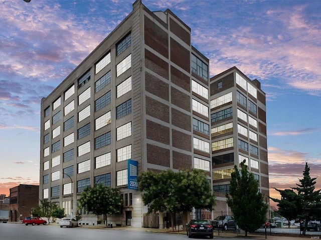 view of outdoor building at dusk