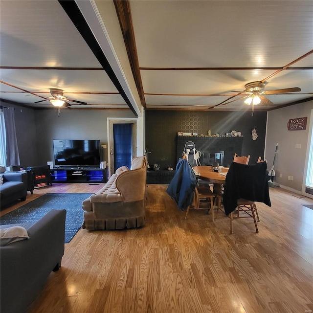 living room with hardwood / wood-style floors and ceiling fan