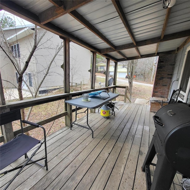 wooden terrace with a grill