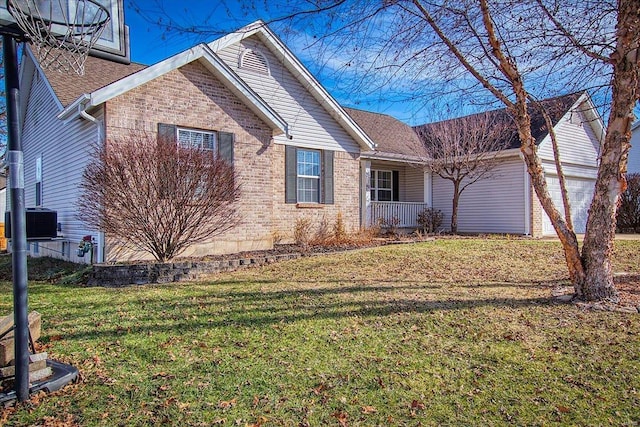 view of front facade with central AC unit, a garage, and a front yard