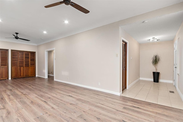 interior space featuring ceiling fan and light hardwood / wood-style flooring