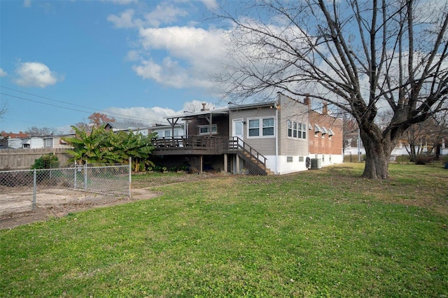 back of property featuring a wooden deck, central AC, and a lawn