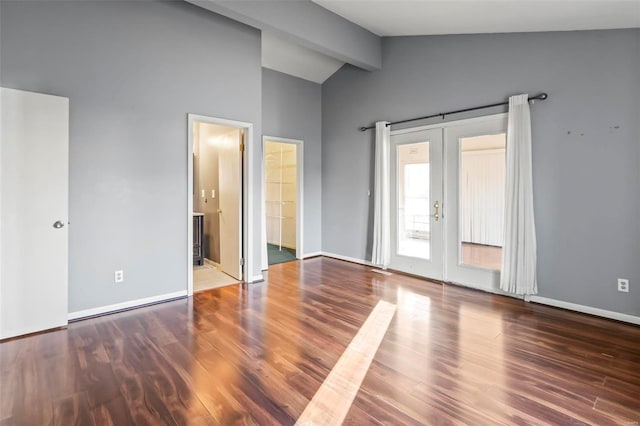 empty room with dark wood-style floors, french doors, lofted ceiling with beams, and baseboards