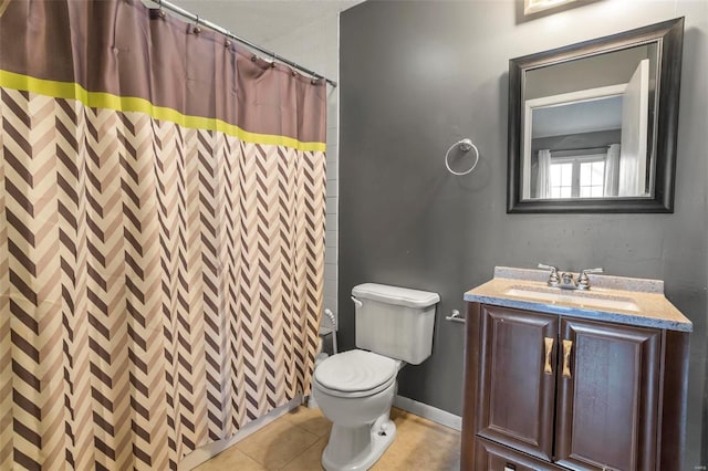 full bath with curtained shower, tile patterned flooring, toilet, vanity, and baseboards