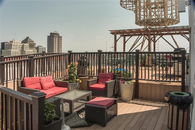 deck featuring an outdoor living space and a pergola